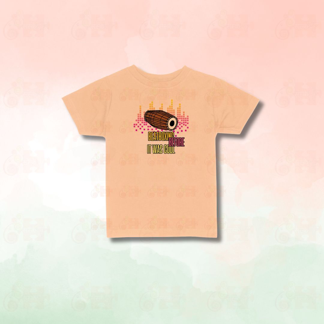 Peach t-shirt with a graphic of a Mridangam drum and the text "Beatboxing Before It Was Cool."