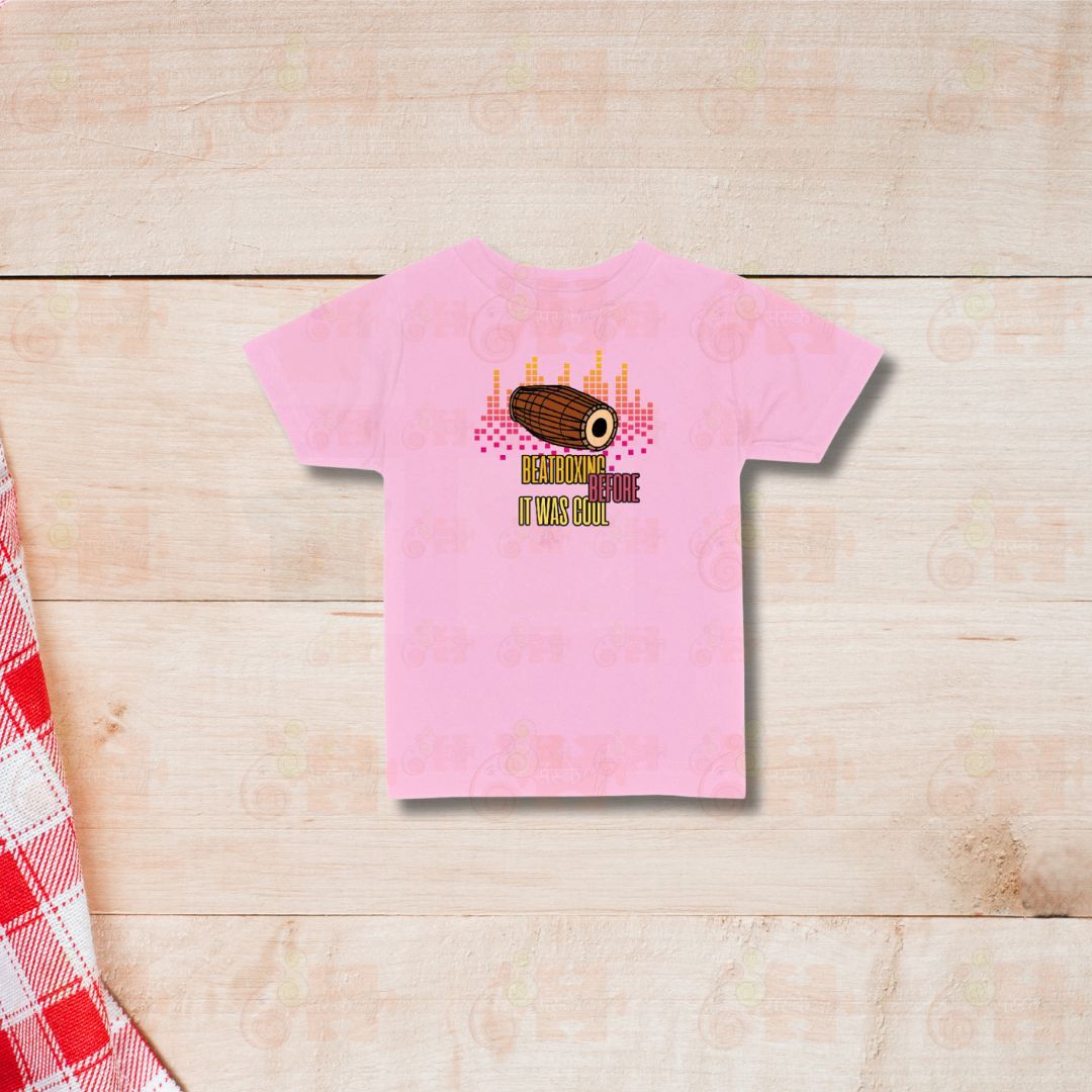 Pink t-shirt with a graphic of a Mridangam drum and the text "Beatboxing Before It Was Cool."