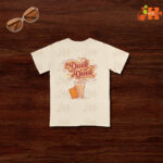 Front view of an ivory (or cream) t-shirt featuring a graphic of a chai glass with a biscuit and the text 'Dunk or Not Dunk'.