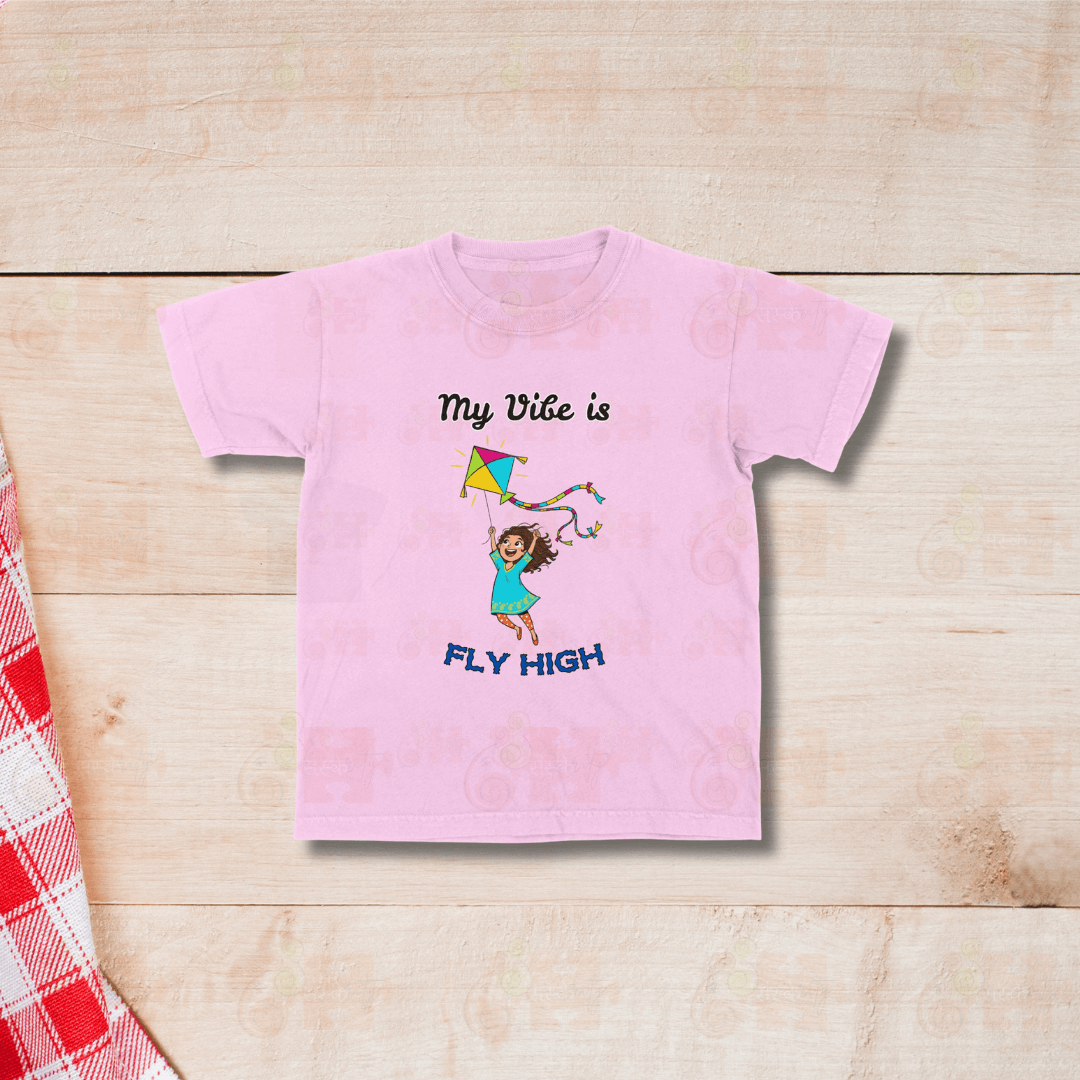 Pink Kids Pongal T-shirt featuring Fly High motivational kite illustration